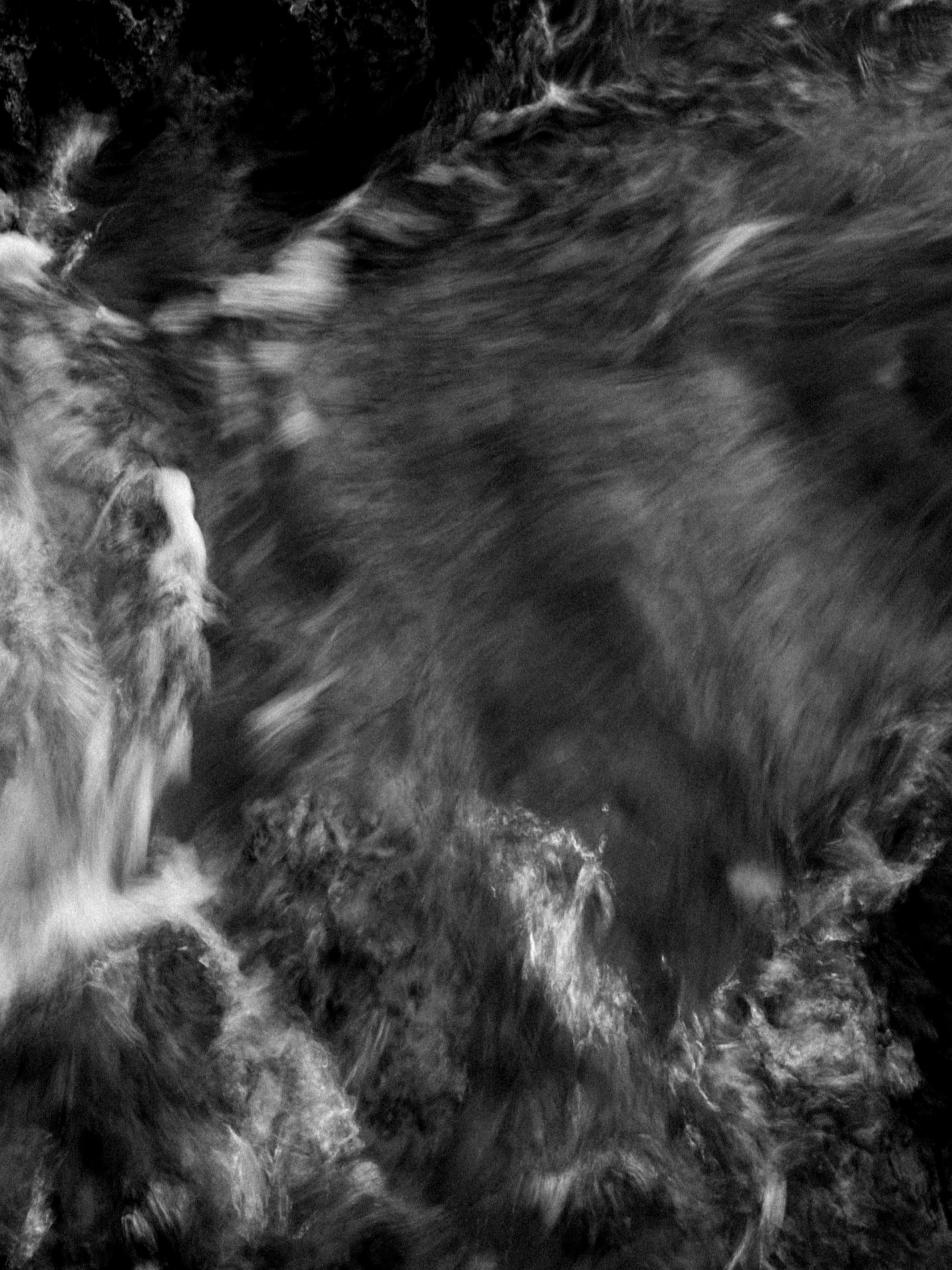 wave crashing on cliff