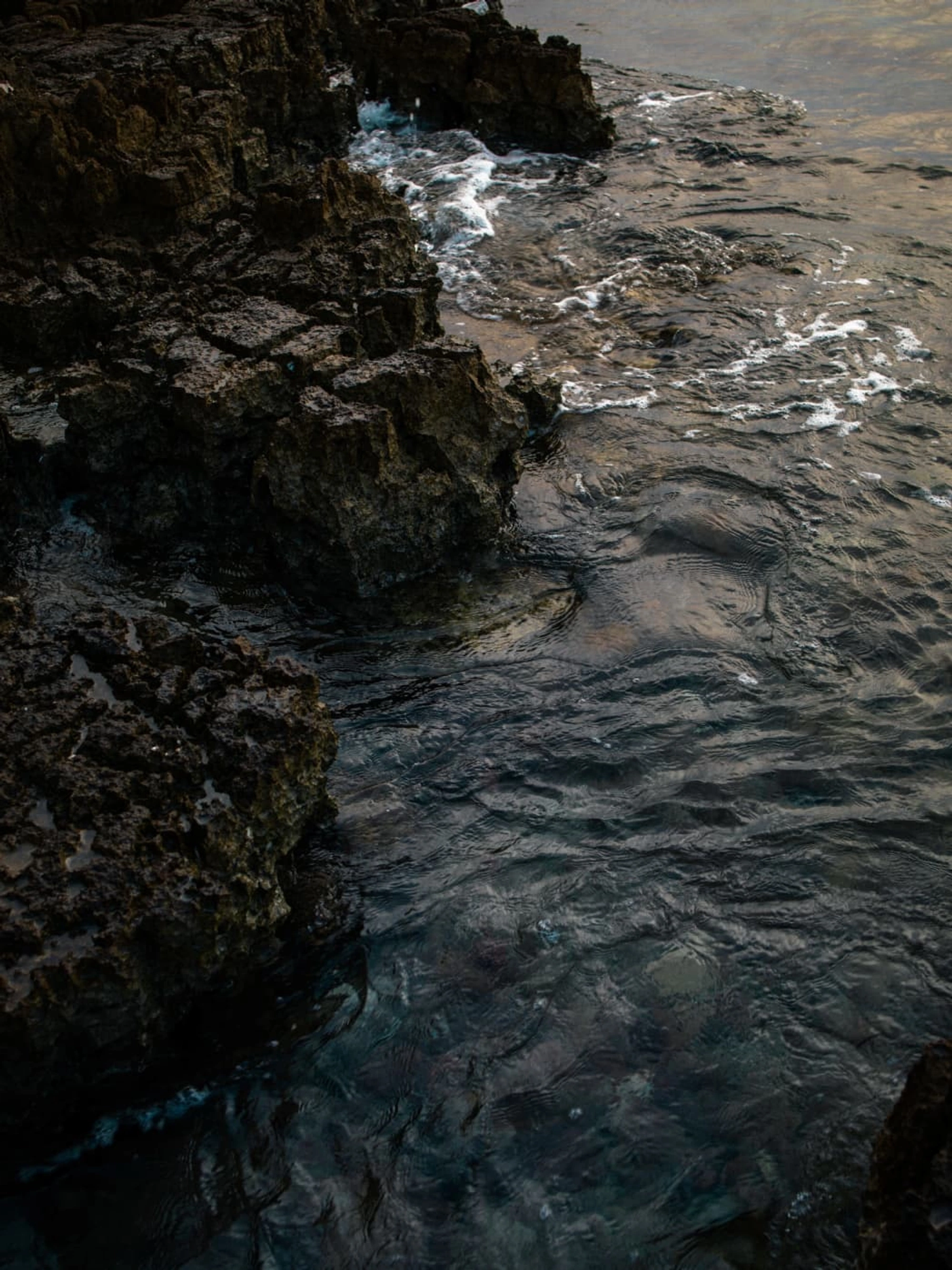 water crashing on rocky cliffs 